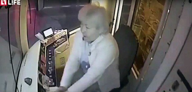 The driver, who is in her 60s, desperately tries to slam on the tram's brakes but it is too late
