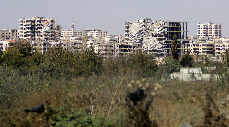 A general view shows damaged buildings in the Waer district in the central Syrian city of Homs, Syria