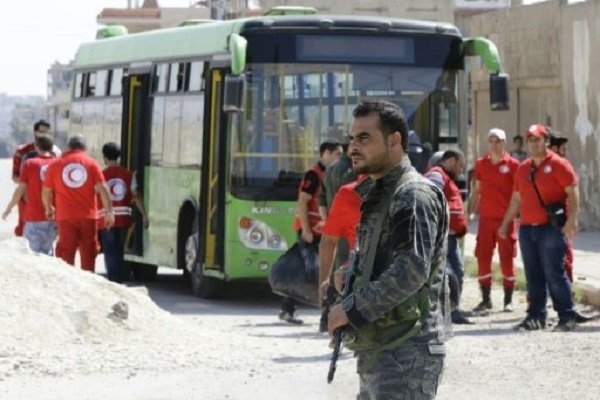 Click to enlarge Syrian soldier stands guard