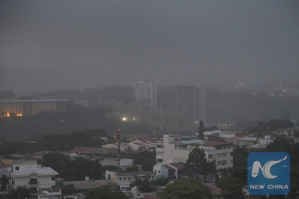 Click to enlarge The city of San Jose is shrouded with volcanic ash as the Turrialba volcano erupts, in Costa Rica, Sept. 19, 2016.