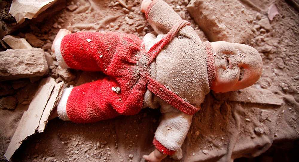 Click to enlarge Doll in Yemen destruction