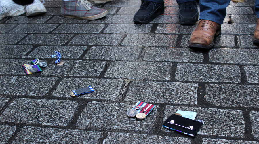 anti-war art project UK, throwing medals downing street
