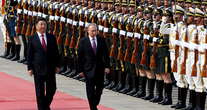 Xi and Putin inspecting troops