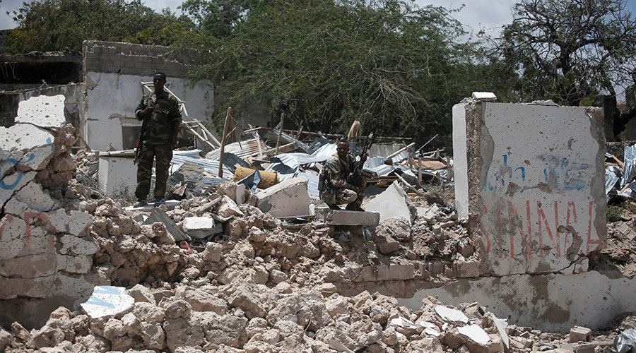 somali soldier rubble squatting