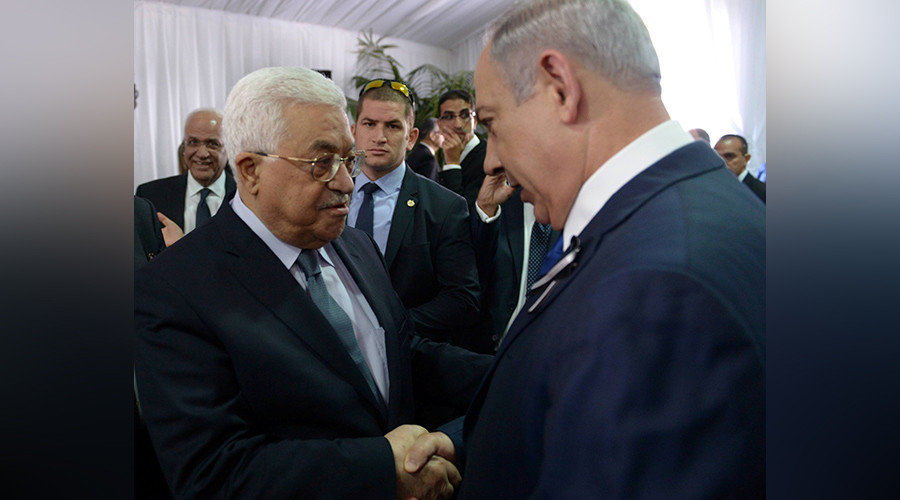 Israeli Prime Minister Benjamin Netanyahu shakes hands with Palestinian President Mahmoud Abbas