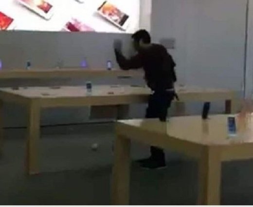 man smashing phones