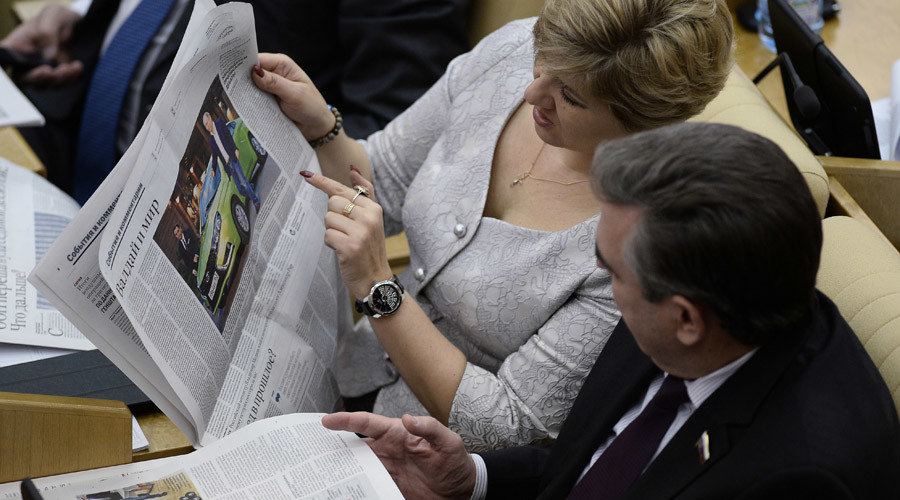Russian's reading newspaper