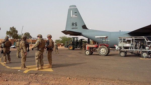 Airmen unload a C-130J Super Hercules
