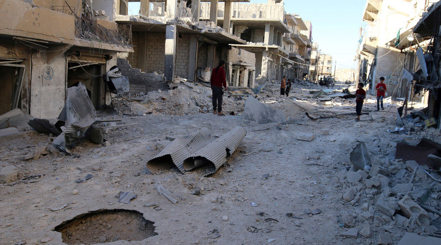 Click to enlarge People inspect a damaged site after airstrikes on the rebel held Aleppo, Syria