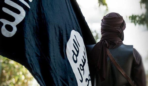ISIL militant with flag