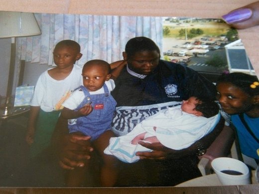 Click to enlarge Michael Sabbie and his children