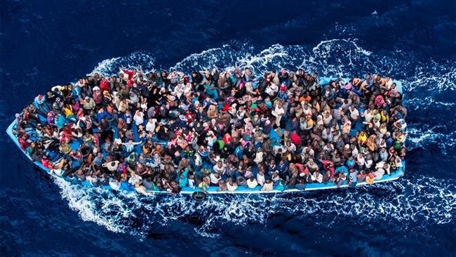 Click to enlarge Refugees in boat