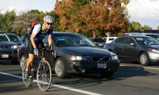 biker with cars
