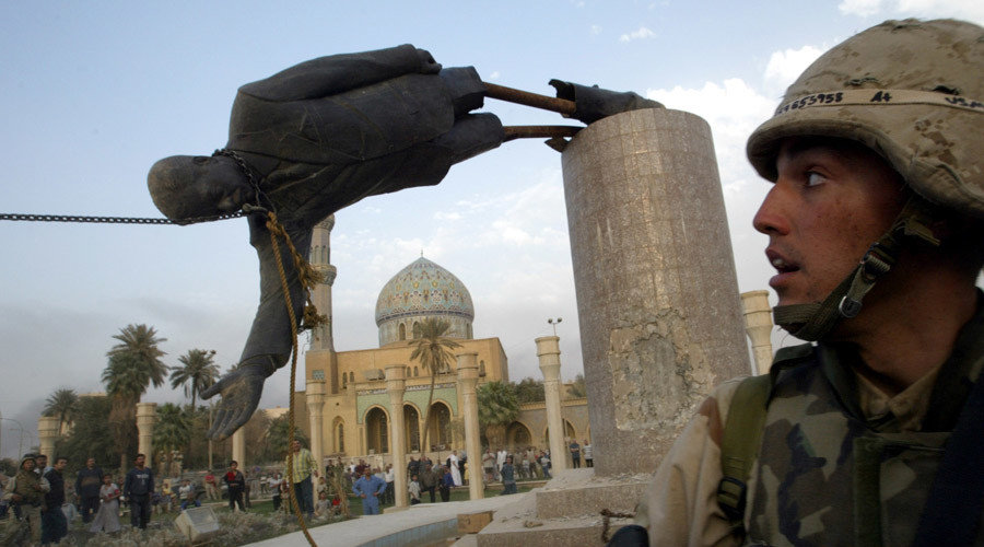 Click to enlarge A U.S. soldier watches as a statue of Iraq's President Saddam Hussein falls in central Baghdad, Iraq April 9, 2003