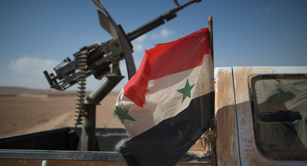 rebel truck with Syrian flag
