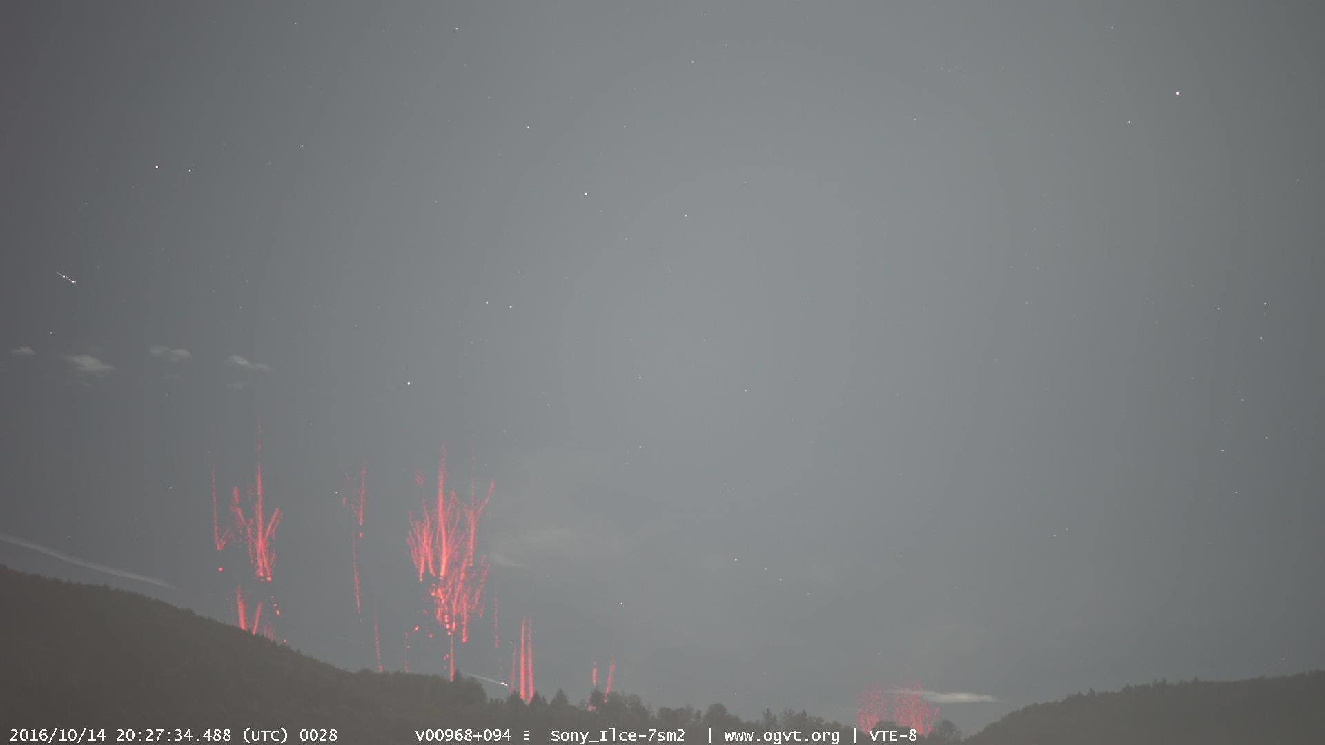 Rare red sprites captured over northern Italy on video from Switzerland