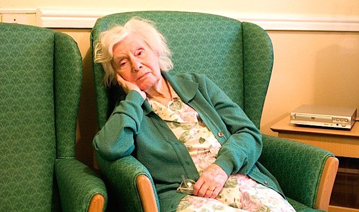 old woman green chair