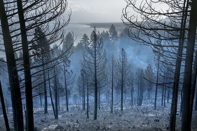 Click to enlarge Lake Tahoe can be seen behind the Emerald Fire along Highway 89, Friday, Oct. 14, 2016 near Lake Tahoe, Nev.