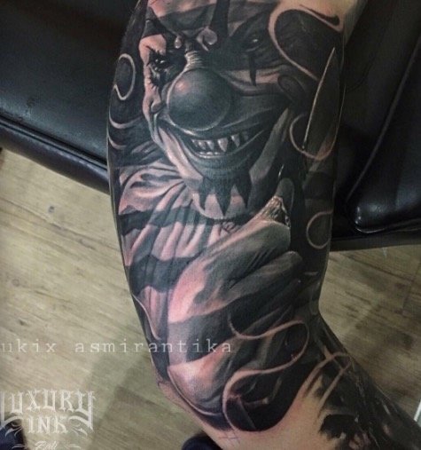 Creepy clown tattoo