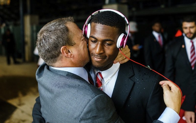 Click to enlarge Coach kissing