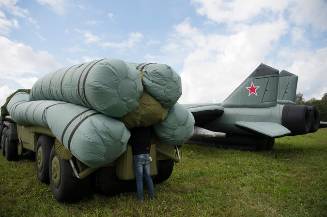Click to enlarge Rusbal employees inflating a mock S-300 missile system