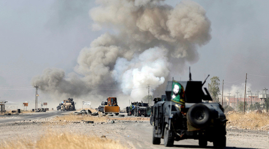 Click to enlarge IED planted by Islamic States fighters explodes in front of Iraqi special forces vehicles in Bartella, east of Mosul