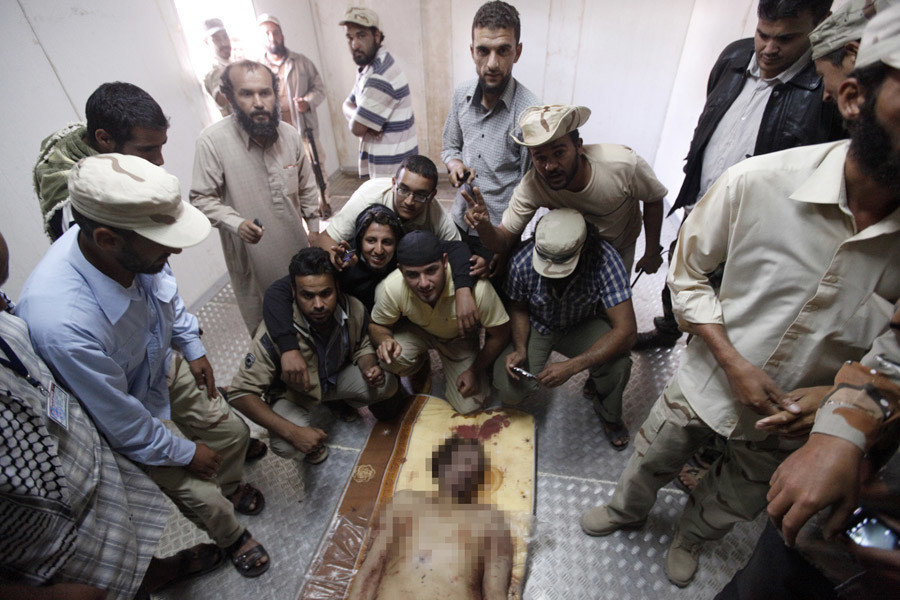 Click to enlarge Libyan leader Muammar Gaddafi is seen inside a storage freezer in Misrata