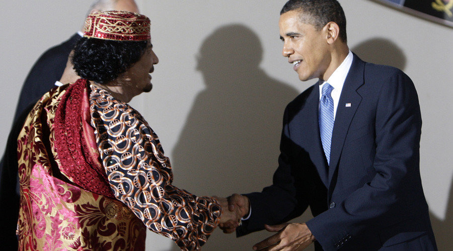 U.S. President Barack Obama shakes hands with Libya's leader Muammar Gaddafi before a dinner at the G8 summit in L'Aquila, Italy, July 9, 2009