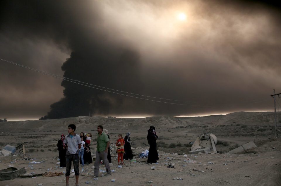 Click to enlarge Smoke from burning Mosul oil wells