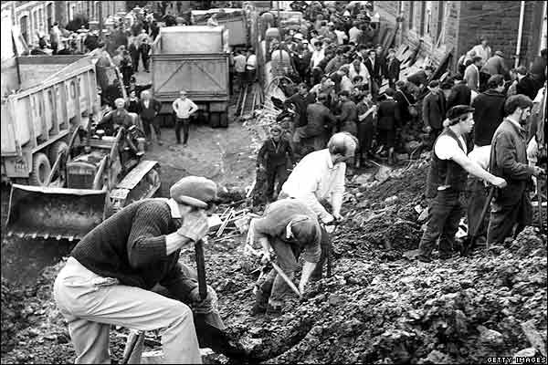 Bulldozers were brought in to help shift the debris and an endless line of lorries carried it away. 