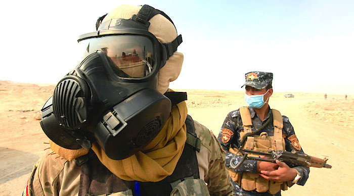 two Iraqi soldiers gas mask