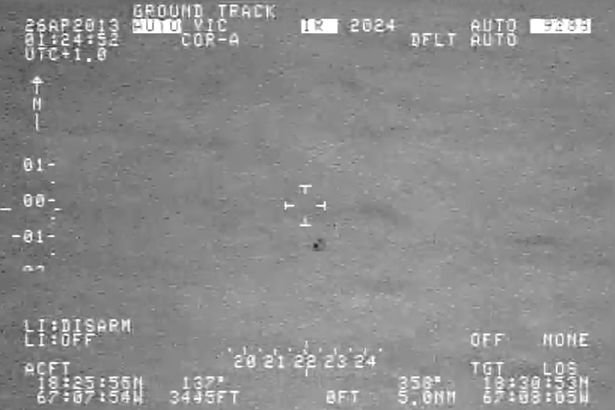 The 'leaked' security footage shows a strange UFO flying over the ocean 