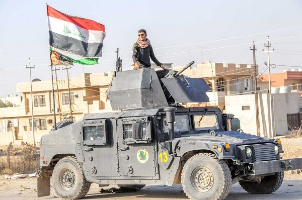 Click to enlarge A Yazidi fighter taking part in the Iraqi army's operation to liberate Mosul.