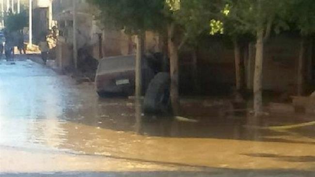 Heavy rain floods a street in the Egyptian city of Ras Gharib in Red Sea province on October 27, 2016 