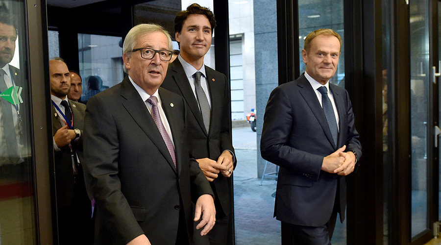 Click to enlarge Canada's Prime Minister Justin Trudeau arrives with European Council President Donald Tusk (R) and European Commission President Jean-Claude Juncker