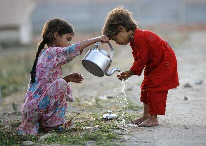 girl helping boy