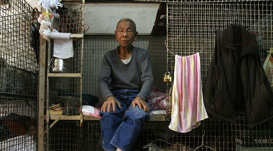 Click to enlarge resident takes a nap at cage home in Hong Kong