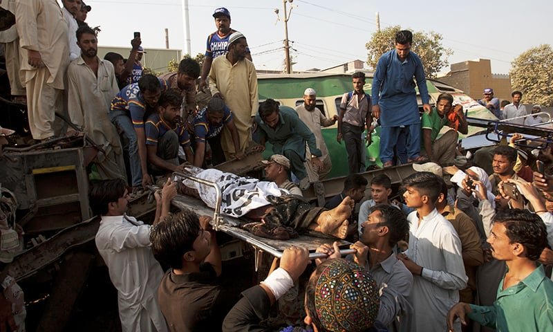 Volunteers remove an injured passenger from the train