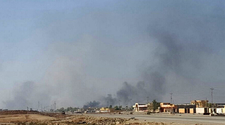Click to enlarge Smoke rises over Karama district in Mosul where Iraqi troops are fighting Islamic State