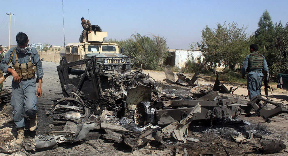 Afghan security forces inspect US airstrike damage
