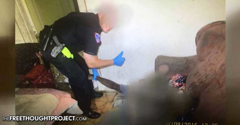 Click to enlarge cop posing with body
