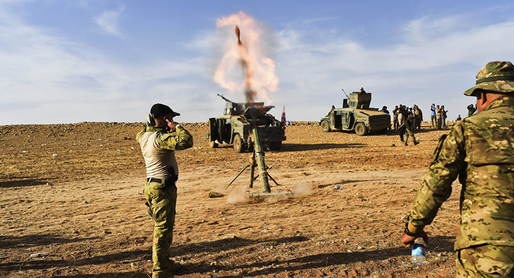 Iraqi forces fire mortar shells towards positions of Islamic State