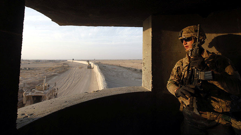 An American soldier takes his position at the U.S. army base in Qayyara, south of Mosul