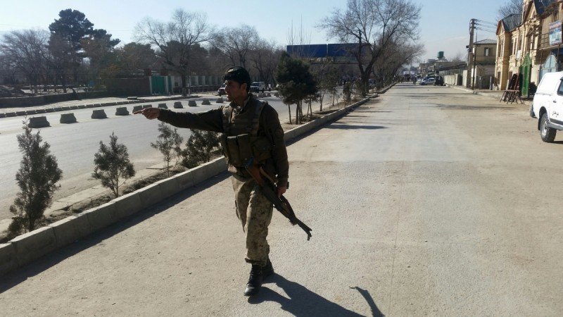 Click to enlarge An Afghan policeman