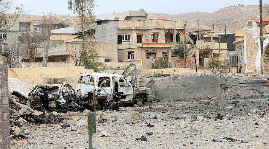 destroyed car belonging to the Islamic state militants is seen in the town of Bashiqa