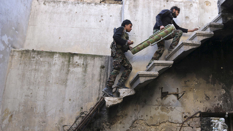 Syrian militants carrying weapon
