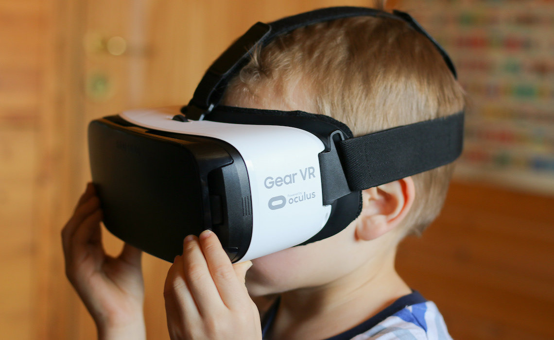 kid in VR headset