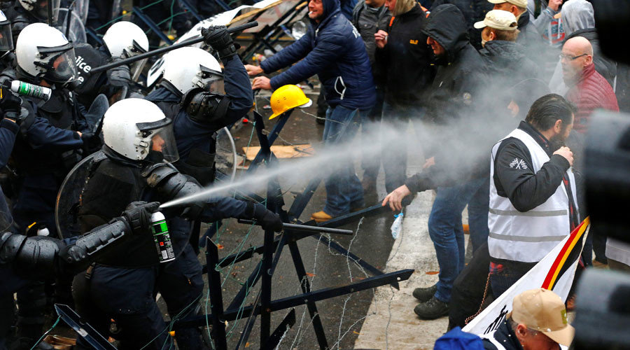 Click to enlarge Belgian soldiers scuffle with police officers during a protest