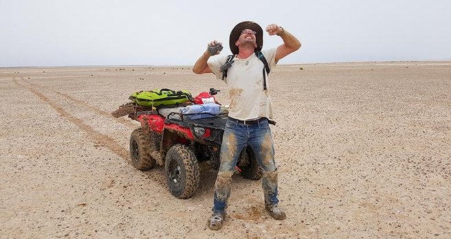 Professor Phil Bland with the 1.7kg meteorite he found in Lake Eyre on January 1. 