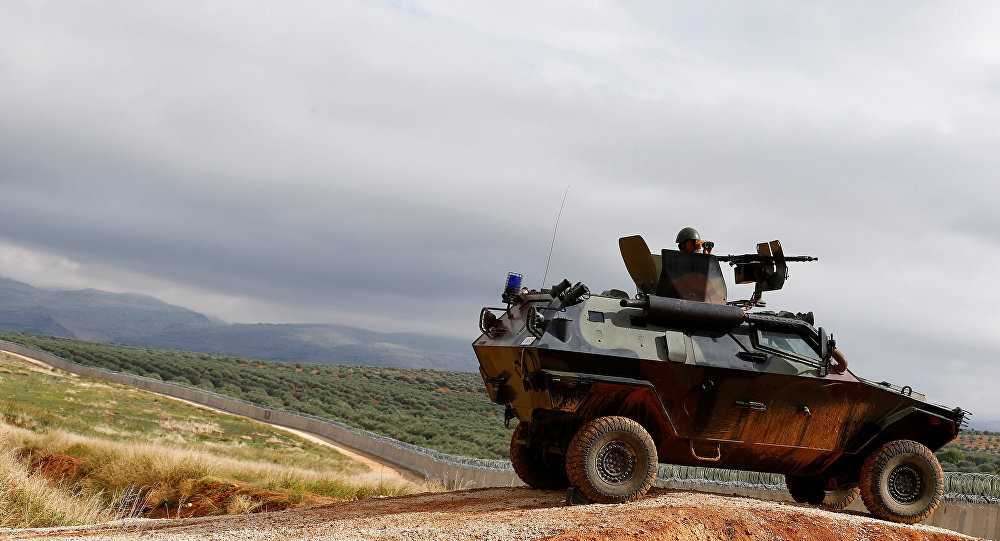 Click to enlarge Turkish soldier in armored vehicle